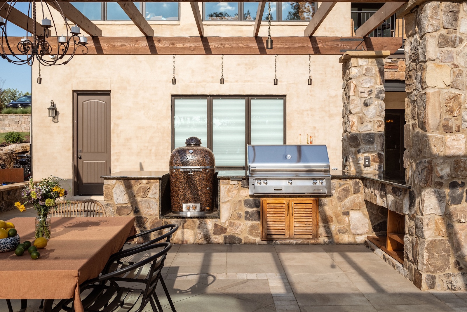 Custom Outdoor Kitchen and Seating Set in Stone | Milosi Nashville Landscaping