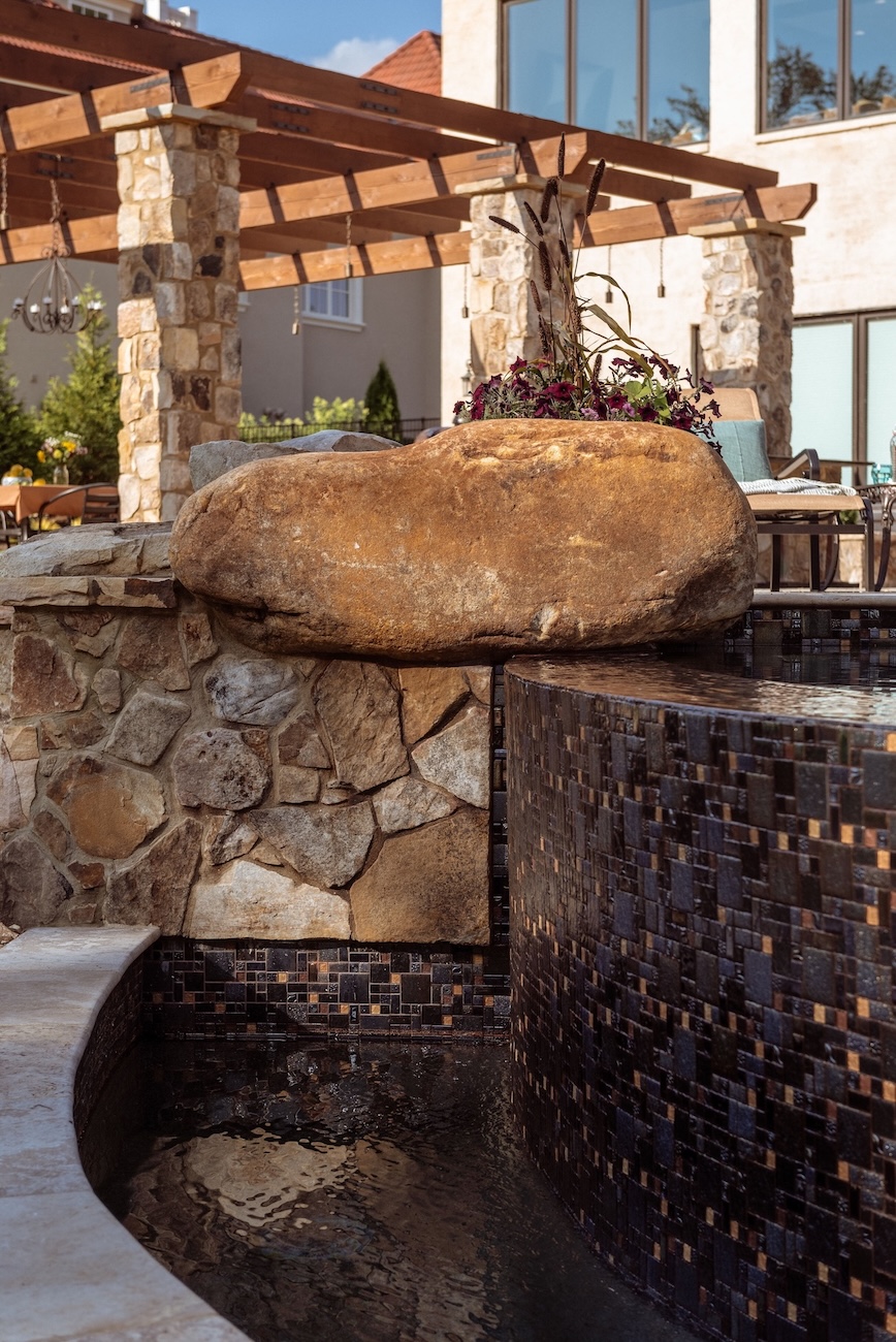 Custom spa with glass tile and natural Stone, boulder | Milosi Nashville Landscaping