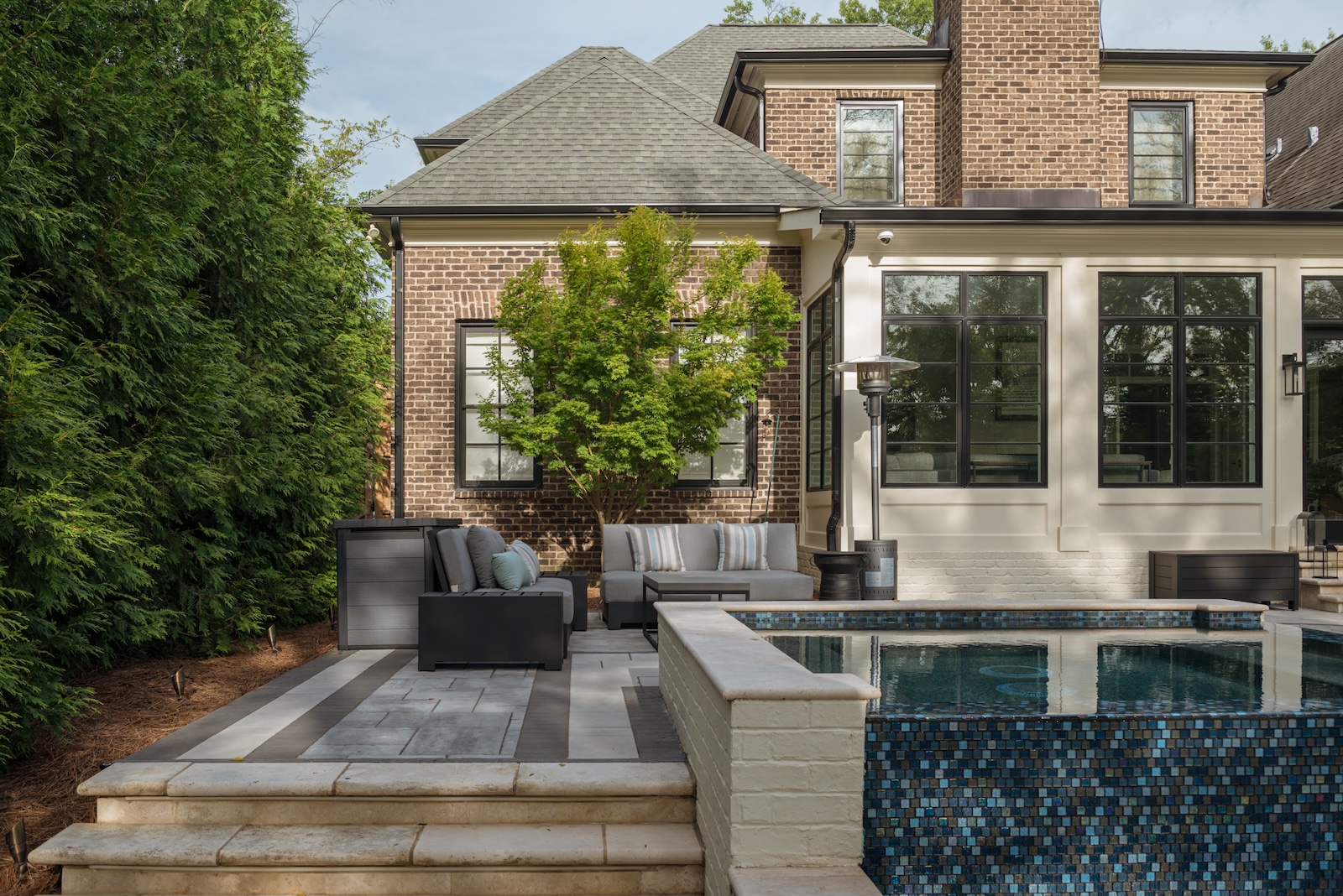 Home Rear View with Modern Patio, Seating, Raised Spa | Milosi Nashville Landscaping