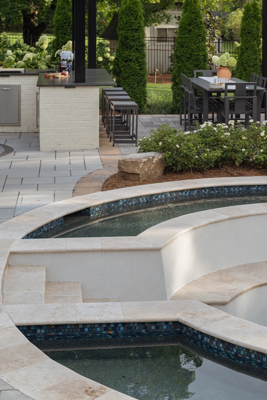 Modern Outdoor Kitchen with Bar Seating, Dining Set by Custom Pool | Milosi Nashville Landscaping