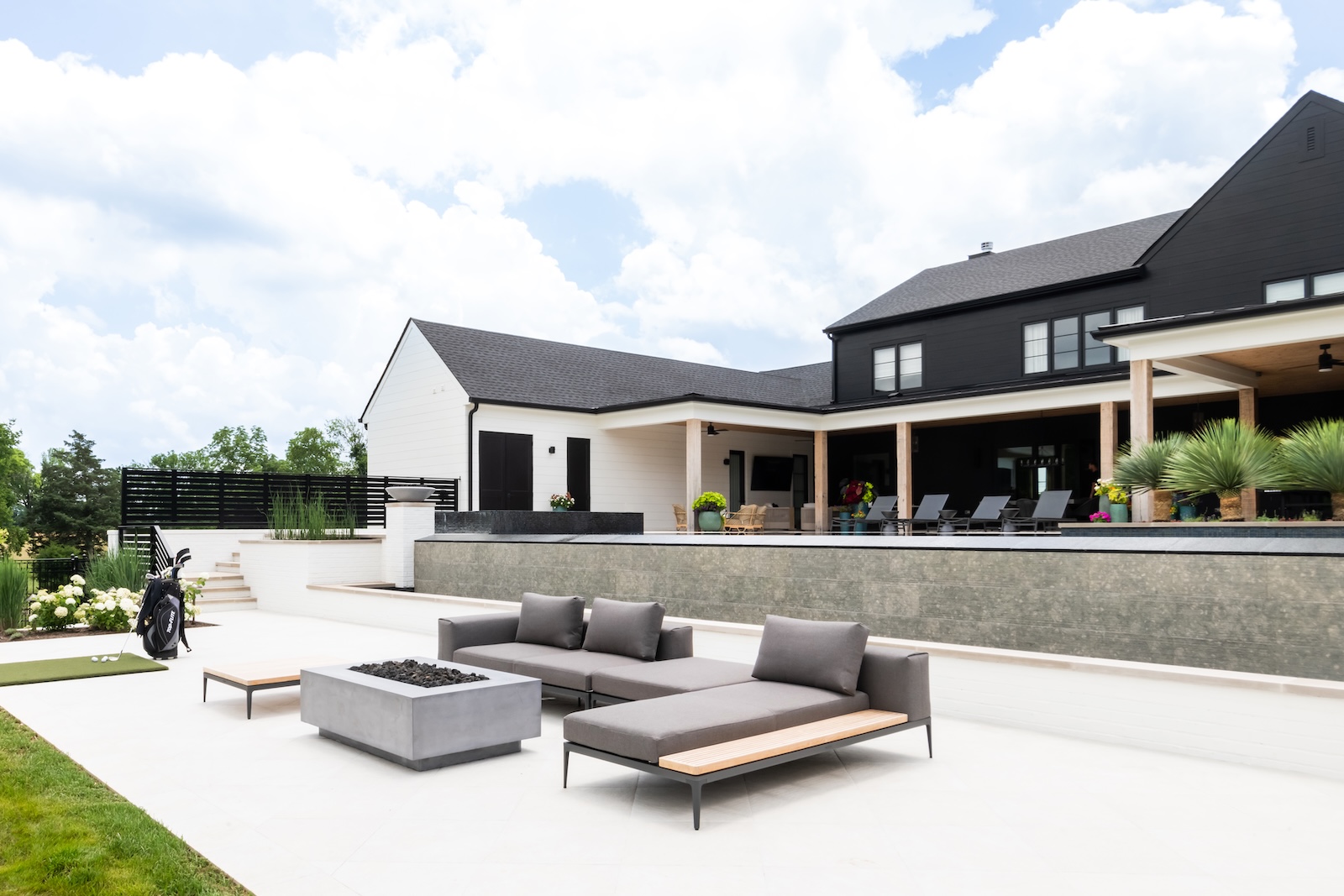 Expansive Patio, Modern Lounge Seating, Firepit, Putting Green, Golf Clubs | Milosi Nashville Landscaping