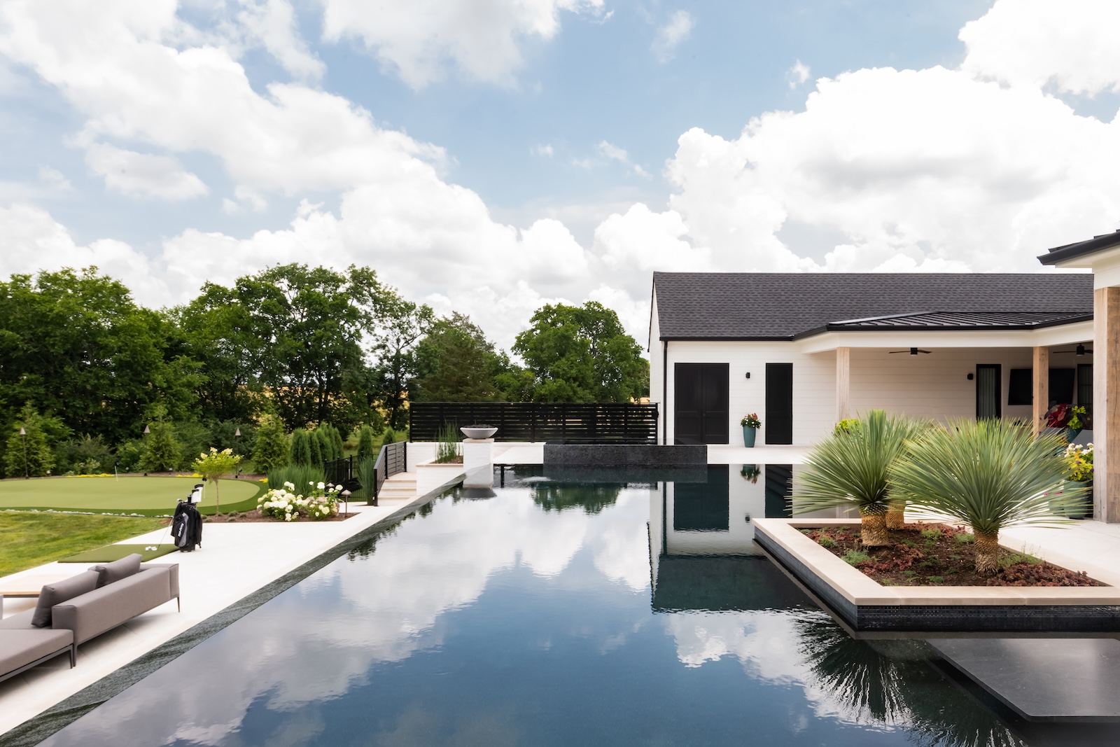 Stunning Infinity Pool, Modern Patio, Miniature Palm Trees, Putting Green, Golf Clubs | Milosi Nashville Landscaping