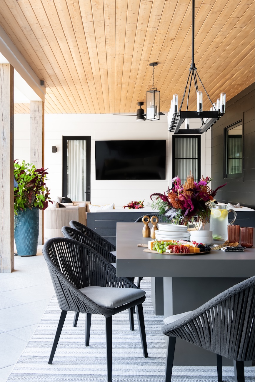 Stunning Outdoor Retreat, Modern Dining Set, Overhead Lighting, Tabletop Flowers, Cheese Plate | Milosi Nashville Landscaping