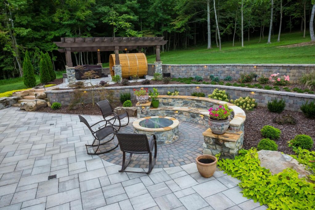 Geometric Patio, Fire Pit, Stone Retaining Walls & Softscapes by Milosi Landscaping Nashville