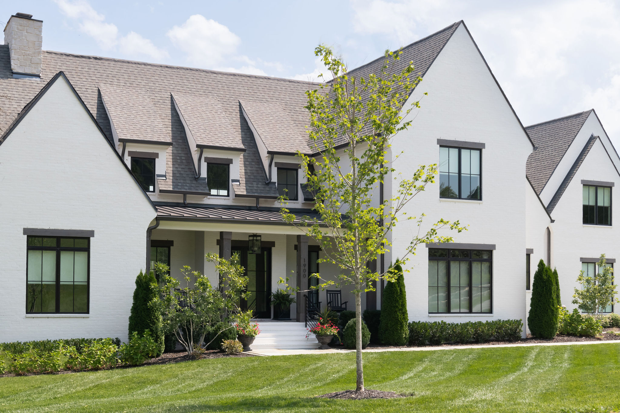 side view of large white home, well landscaped in Franklin TN.