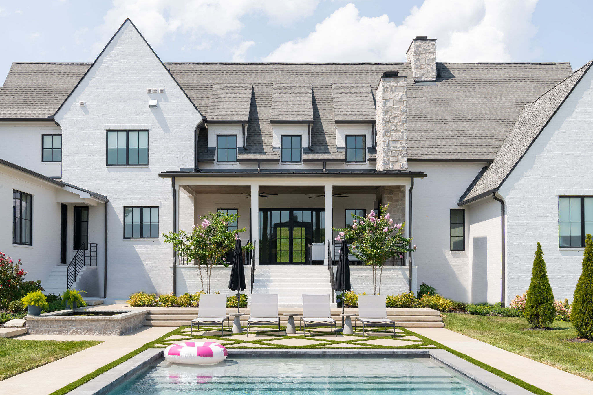 Close up view of porch and custom pool built by Milosi Landscapes.