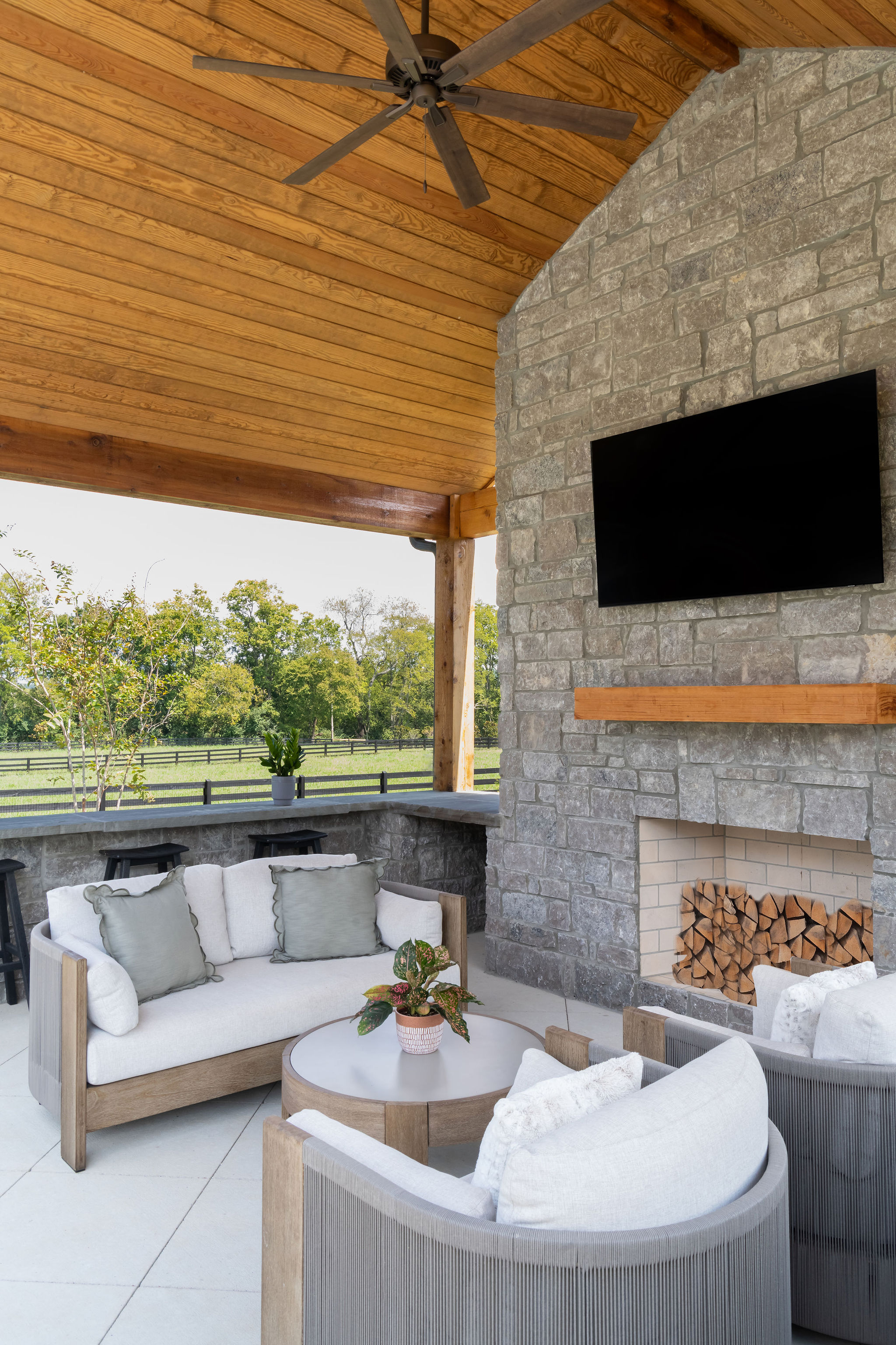 Close up of fireplace and TV as part of ourdoor kitchen built by Milosi Landscapes.